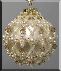 a white ornament with pearls and beads