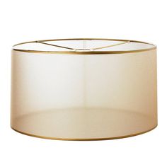 a white lampshade with a gold trim around the bottom and an inner shade