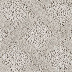 an up close shot of the texture of a carpet with white and gray color scheme