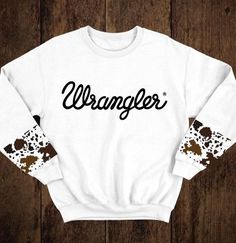 Country Sweatshirt Ideas, Wrangler Cow Print Sweatshirt, Cow Print Clothes Aesthetic, Things You Need For A Horse, Country Sweatshirts & Hoodies, Cow Print Shirt Ideas, Western Workout Clothes, Cute Western Clothes For Women, Western Crewneck Outfit