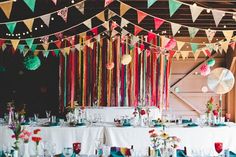 the tables are covered with colorful streamers and decorations