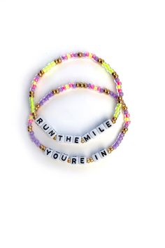 Motivational mantra bracelets inspired by running but cute enough to wear all day long. Wear alone or pair with matching stack, choose from two sizes. Two bracelets included. Hand-crafted using glass beads and acrylic letter beads. Elastic stretch bracelet Care: Handle with care, remove when showering, swimming, avoid contact with lotions and chemicals Hand made in the U.S.A. Running Quotes, Running Bracelet, Clay Bracelets, Disney Bracelet, Mantra Bracelet, Team Bonding, Wrist Stacks, Acrylic Letters, Clay Bracelet