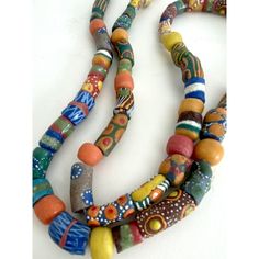 Vintage handmade African trade beads strung on raffia.  A nice addition to layer or drape over home decor elements.  These individual beads were each handmade using natural organic dyes and adornments. African Trade Bead Jewelry, African Beaded Bracelets, African Bracelets, African Beads Necklace, African Trade Beads, Handmade African, Unusual Jewelry, African Beads, African Jewelry