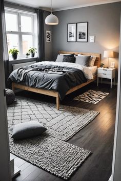 a bedroom with gray walls and wooden floors