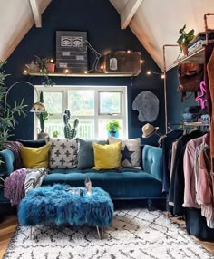 a living room filled with furniture and lots of plants on top of the windowsill