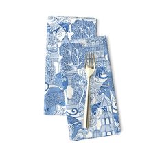 two blue and white napkins with forks on them