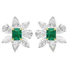 A very beautiful and fashionable pair of stud earrings, featuring radiant cut color-rich green emeralds weighing 1.17 carats total, set on a classic four prong basket setting made of 18K yellow gold. Surrounded by brilliant pear and marquise shape diamonds weighing 3.67 carats total, set on a floral motif design made of 18K white gold. These lovely earrings are 17.40 mm in length and 15 mm in width. Roman Malakov is a custom house, specializing in creating anything you can imagine. If you would Diamond Emerald Earrings, Marquise Shape Diamond, Motif Design, Radiant Cut, Emerald Earrings, Lovely Earrings, Stunning Jewellery, Diamond Earrings Studs, Diamond Studs