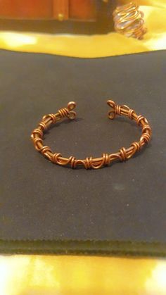 a close up of a bracelet on a table