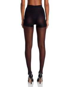 A silky sheer leg with control top for a slim silhouette. Fitted Smoothing Tights Short Length, Fitted Smoothing Short Length Tights, Elegant Short-length Fitted Tights, Elegant Short-length Tights, Elegant Fitted Mid-thigh Length Tights, Elegant Thigh-high Compressive Bottoms, Sheer High Stretch Legwear With High-cut Leg, High Stretch Sheer Legwear With High-cut Leg, Elegant Nylon Bottoms For Night Out