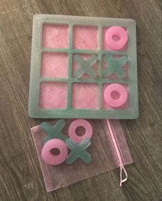 an ice tray with doughnuts and pretzels in it on a table