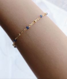 * DETAILS* This dainty bracelet is a perfect gift to the one you love or to yourself. A nice every day bracelet. - AAA+ Burma Blue Sapphire Faceted Beads 2mm - 14k Gold Filled Chain - 14k Gold Filled Spring Ring Clasp ✨ All components are 14k Gold Filled. 👉🏻 How to measure 1. Use a string to mark the spot you would like your bracelet. (⭐️remember to add some space for a loose fit) 2. Lay the string flat and measure the string's length with a ruler to get your final length. 👉🏻 You may also li Topaz Bracelet, Carnelian Bracelet, Blue Topaz Bracelet, Emerald Bracelet, Birthday Gift For Women, Jewelry Accessories Ideas, Birthstone Bracelet, Dainty Bracelet, Sapphire Bracelet