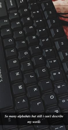 a close up of a keyboard with the words so many alphabets but still i can't describe my words