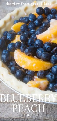 a pie with blueberries and peaches on it