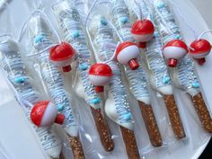 there are many toothbrushes wrapped in plastic and decorated like santa's hats