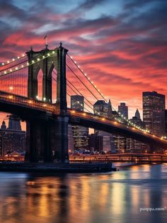 the brooklyn bridge is lit up at night