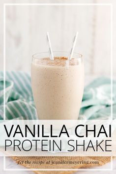 vanilla chai protein shake in a glass with two straws on top and the text overlay reads, vanilla chai protein shake