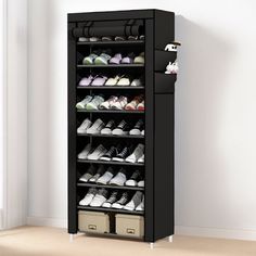 a black shoe rack with several pairs of shoes on the top shelf and two baskets below it