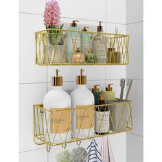 two gold metal shelves holding soap, lotion and other bathroom items