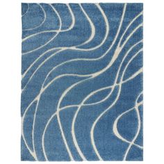 a blue rug with wavy lines on the top and bottom, in front of a white background