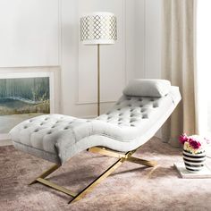 a white chaise lounge chair in a living room