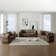 a living room filled with furniture and windows