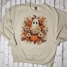 Hand Bleached And Hand Pressed Using Sublimation Printing Sand Colored Unisex Crew Neck Sweatshirt, Cotton And Polyester Blend True To Size Fit, Very Cozy If You Would Like An Oversized Look Order A Size Up! Made To Order - Ships In 7-10 Bsd Fall Sweatshirt Ideas, Cute Fall Things, Halloween Shirt Ideas, Flower Pumpkin, Boho Pumpkin, Floral Ghost, Ghost Reading, Sweatshirt Ideas, Retro Ghost