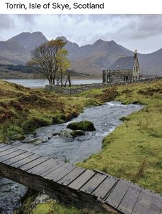 a wooden bridge crosses a stream in the scottish countryside