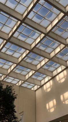 the inside of a building with lots of windows and skylights on it's ceiling