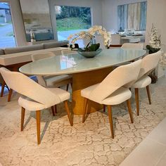 a dining room table with chairs around it