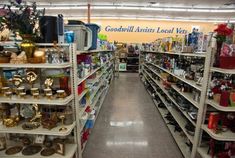 an aisle in a store filled with shelves full of goods and decorations on the shelves