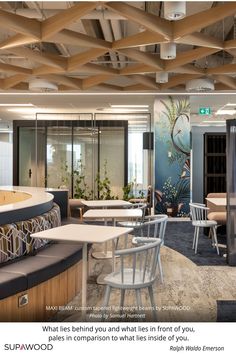 the interior of a restaurant with tables and chairs