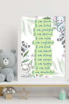 a teddy bear sitting on top of a shelf next to a framed print with the words i am loved