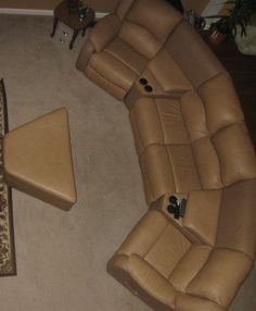 a living room with two recliners and a rug on the floor