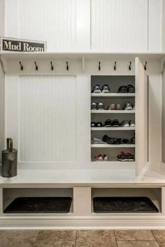 the mud room is clean and ready to be used as a shoe storage area for shoes