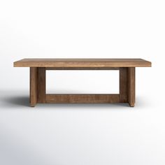 a wooden table sitting on top of a white floor