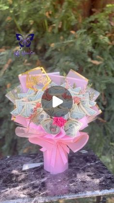 a bouquet made out of money sitting on top of a table