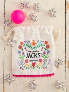 a drawstring bag sitting on top of a wooden table