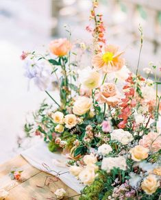 a bunch of flowers that are sitting on a table