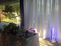 the table is covered with flowers and lights