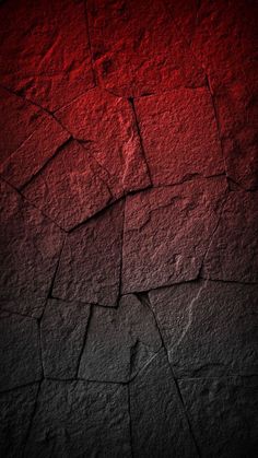 a red and black background with cracks in the concrete, which is very rough to see