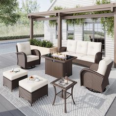 an outdoor living area with wicker furniture