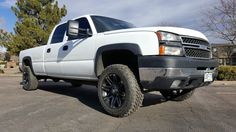 a white truck parked in a parking lot