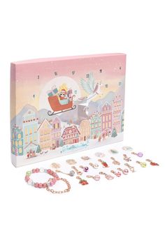 a pink box with lots of jewelry in it and a santa on a sleigh