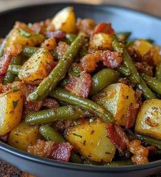 a bowl filled with potatoes and green beans