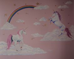 two unicorns are standing in the clouds with a rainbow painted on the wall behind them