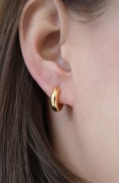 A chubby silhouette lends pillowy dimension to these dainty sterling silver hoop earrings plated in warm 18-karat gold. 5/8" hoop diameter; 1/4" width Hinge with snap-post closure Sterling silver/18k-gold plate Imported Everyday Gold Earrings Indian, Small Gold Hoop Earrings Aesthetic, Simple Small Hoop Earrings, Gold Hoop Earrings Aesthetic, Pure Gold Earrings, Small Hoops Earrings, Small Hoop Earrings Gold, Simple Ring Design, Small Gold Earrings