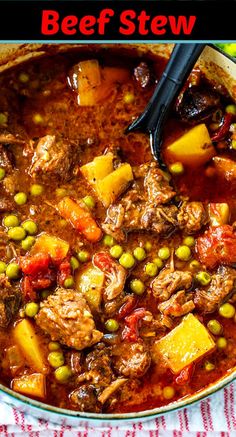 beef stew with potatoes and peas in a pot on a red and white checkered table cloth