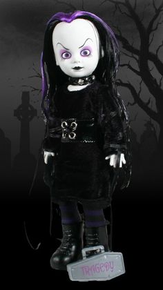 a creepy doll with purple hair and black clothes standing in front of a dark background