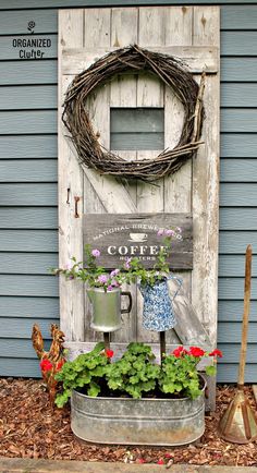 an old door is decorated with flowers and plants