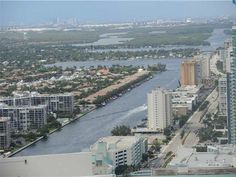 an aerial view of the city and waterway from a high rise building in miami, florida